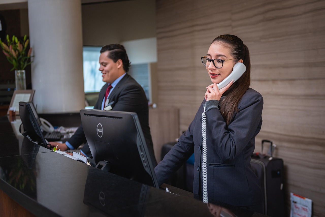 Receptionists, phone call, hotel — Streamline Budgeting and Scheduling for Residential Projects with Specialized Software